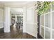 Elegant foyer with hardwood floors, white trim, and a view of the dining area, creating a grand entrance at 107 Southern Acres Dr, Fuquay Varina, NC 27526