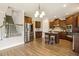 Kitchen with stainless steel appliances, kitchen island, and wooden cabinets at 107 Southern Acres Dr, Fuquay Varina, NC 27526