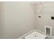 Bright laundry area ready for your appliances, with a wire rack overhead for added storage at 107 Southern Acres Dr, Fuquay Varina, NC 27526