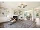 Open concept living room with fireplace and views into the dining room at 107 Southern Acres Dr, Fuquay Varina, NC 27526