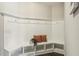 Mudroom entry with white wainscoting, bench seating with storage cubbies, coat hooks, and two accent pillows at 107 Southern Acres Dr, Fuquay Varina, NC 27526