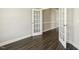 Bright office with wood floors and glass French doors, offering versatile use and natural light at 107 Southern Acres Dr, Fuquay Varina, NC 27526