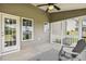 Covered porch features an overhead fan, backyard views, and a gray Adirondack chair for outdoor relaxation at 107 Southern Acres Dr, Fuquay Varina, NC 27526
