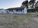 Single-story home featuring a well-maintained lawn and a carport on the side at 109 Pine St, Dunn, NC 28334