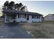Cozy single-story home with a convenient carport and a paved driveway at 109 Pine St, Dunn, NC 28334
