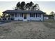 Charming single-story home with a covered carport and inviting entrance at 109 Pine St, Dunn, NC 28334