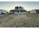 A single-story home with an attached carport, surrounded by other houses and trees at 109 Pine St, Dunn, NC 28334