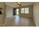 Bright living room featuring light wood flooring and neutral paint throughout at 109 Pine St, Dunn, NC 28334