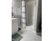 Shower with chrome fixtures, removable shower head, and built in shelves at 109 Pine St, Dunn, NC 28334