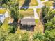 Aerial view of home featuring a spacious backyard with mature trees, a screened porch, and fire pit at 114 Cherryhill Dr, Four Oaks, NC 27524