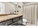 Neutral bathroom featuring a single sink vanity and shower with curtain at 114 Cherryhill Dr, Four Oaks, NC 27524