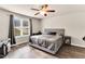 Comfortable bedroom featuring a ceiling fan and window at 114 Cherryhill Dr, Four Oaks, NC 27524