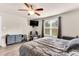 Comfortable bedroom featuring a ceiling fan, window and recliner at 114 Cherryhill Dr, Four Oaks, NC 27524