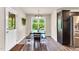 Bright dining area featuring a wood table with bench seating and a view to the outdoors at 114 Cherryhill Dr, Four Oaks, NC 27524