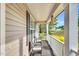Cozy front porch with comfortable seating, complemented by neutral tones and natural light, perfect for relaxation at 114 Cherryhill Dr, Four Oaks, NC 27524