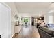 Open-concept living space with hardwood floors, abundant natural light, and seamless flow to the dining and kitchen areas at 114 Cherryhill Dr, Four Oaks, NC 27524