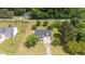 Beautiful home with mature trees on a large lot, featuring a long driveway and well-maintained landscaping at 114 Lynnville Ct, Lillington, NC 27546