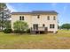 Expansive backyard with a patio, lawn, and mature trees at 114 Lynnville Ct, Lillington, NC 27546
