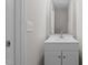 Bathroom featuring a vanity with white cabinets, framed mirror, and modern faucet at 114 Lynnville Ct, Lillington, NC 27546
