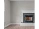 Close-up of the living room fireplace with a white mantel and tile surround at 114 Lynnville Ct, Lillington, NC 27546