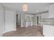 Eat-in kitchen area with white cabinets, granite countertops, and stainless steel sink at 114 Lynnville Ct, Lillington, NC 27546