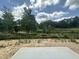 View from backyard of neighborhood with trees and blue skies at 1248 Randwick Valley Ct, Zebulon, NC 27597