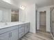 Bathroom features double sink vanity and large mirror at 1248 Randwick Valley Ct, Zebulon, NC 27597