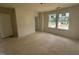 Bedroom with large windows, bright lighting, and unfinished flooring at 1248 Randwick Valley Ct, Zebulon, NC 27597