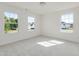 Sunlit bedroom featuring three windows with verdant outdoor views at 1248 Randwick Valley Ct, Zebulon, NC 27597