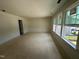Bright bedroom with large windows and unfinished flooring at 1248 Randwick Valley Ct, Zebulon, NC 27597