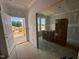 A view of the unfinished entryway with sunlight streaming through the doorway, waiting for its personal touches at 1248 Randwick Valley Ct, Zebulon, NC 27597