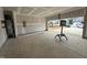 Spacious garage with water heater and open door to the outside at 1248 Randwick Valley Ct, Zebulon, NC 27597