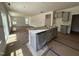 Bright kitchen featuring large island, gray cabinets, and natural light at 1248 Randwick Valley Ct, Zebulon, NC 27597