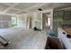 Unfinished living room featuring ample space, natural light, and open access to the kitchen for seamless living at 1248 Randwick Valley Ct, Zebulon, NC 27597