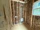 Bathroom framing with insulation, utility connections, and window, ready for finishing touches at 13159 S Nc-231 Hwy, Middlesex, NC 27557