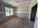 Bedroom with drywall and large window offering outdoor views, ready for customization at 13159 S Nc-231 Hwy, Middlesex, NC 27557
