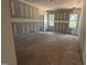 Bedroom under construction with window views, drywall, and unfinished floors at 13159 S Nc-231 Hwy, Middlesex, NC 27557
