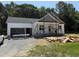 An exterior view of a home under construction with white siding and a grey shingled roof at 13159 S Nc-231 Hwy, Middlesex, NC 27557
