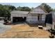 New home construction shows the frame and roof, garage is visible at 13159 S Nc-231 Hwy, Middlesex, NC 27557