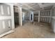 Unfinished living room with drywall installation and visible doorways for future rooms at 13159 S Nc-231 Hwy, Middlesex, NC 27557