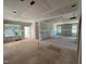 View of a living room under construction showing drywall and multiple windows with exterior views at 13159 S Nc-231 Hwy, Middlesex, NC 27557