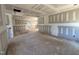 Spacious living room showcasing drywall installation progress with unfinished floors at 13159 S Nc-231 Hwy, Middlesex, NC 27557