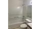 Tub and shower combination with white ceramic tile at 1331 Crab Orchard Dr # 001, Raleigh, NC 27606