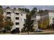 A view of the exterior showing well-maintained landscaping and classic building architecture at 1331 Crab Orchard Dr # 001, Raleigh, NC 27606