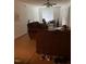 Carpeted living room with ceiling fan and view to the front door at 1331 Crab Orchard Dr # 001, Raleigh, NC 27606