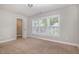 Inviting bedroom with natural light from large windows and a walk-in closet; ideal for comfortable living at 141 Shad Boat Ln, Clayton, NC 27520