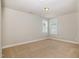 A sunlit bedroom features carpet, and double windows; neutral colors create a bright and spacious environment at 141 Shad Boat Ln, Clayton, NC 27520
