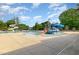 Community pool area featuring multiple water slides, wading pool, and mature trees at 141 Shad Boat Ln, Clayton, NC 27520