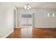 Dining room featuring hardwood floors, a chandelier, and sliding glass doors at 141 Shad Boat Ln, Clayton, NC 27520