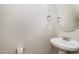 Small half-bathroom featuring a pedestal sink and mirror at 141 Shad Boat Ln, Clayton, NC 27520